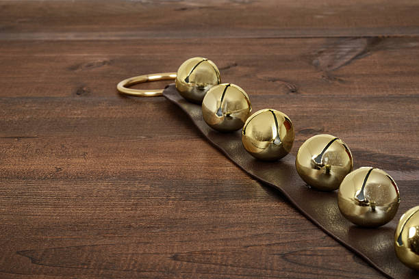 christmas sleigh bells on wood