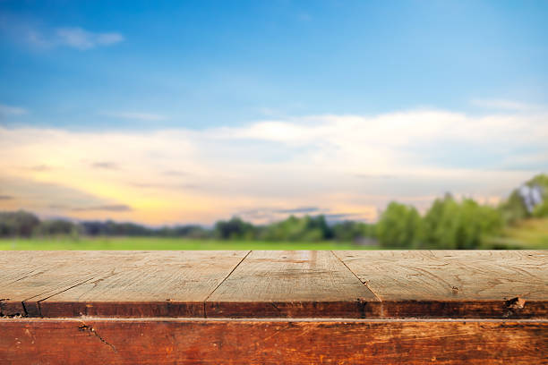 Empty table and field of grass and perfect sky background