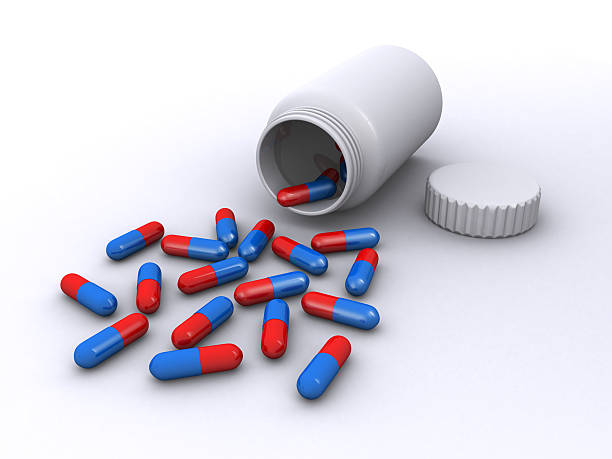 istock Medicine bottle with pills 492943548