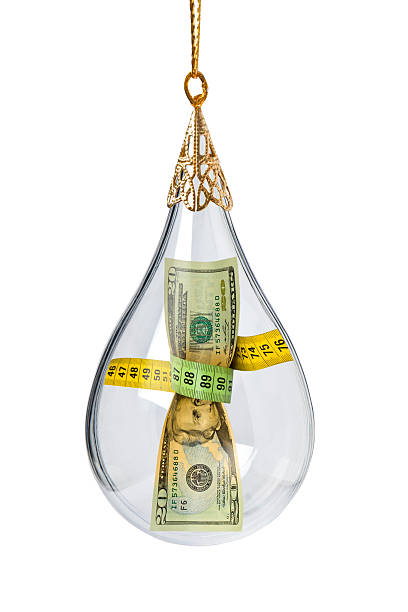 istock Dollar Bill In a Christmas Ornament 492946056