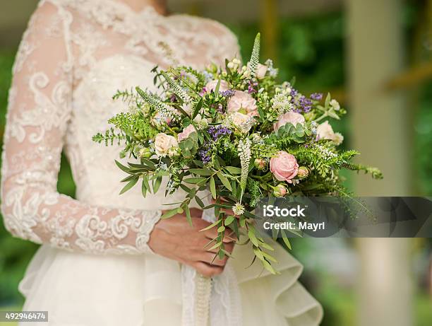 Beautiful Wedding Rustic Bouquet In Brides Hand Stock Photo - Download Image Now - 2015, Arts Culture and Entertainment, Bouquet