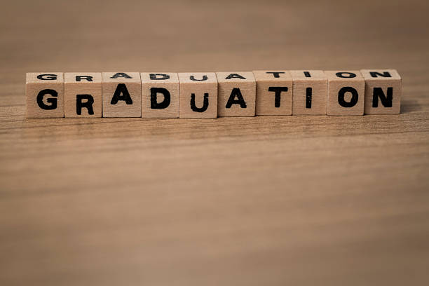 istock Graduation in wooden cubes 492947372