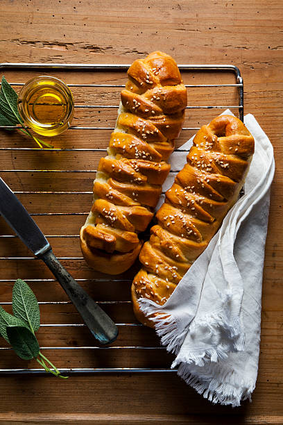 istock Freshly baked salty braided bread loaf on a baking sheet 492956360