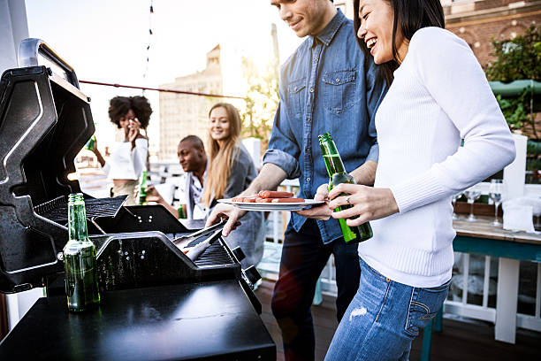 istock Friends grilling on a rooftop in New York Manhattan 492956660