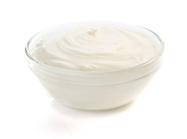istock sour cream in bowl on white 492956978