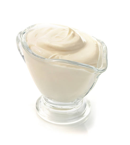 istock sour cream in bowl on white 492957024