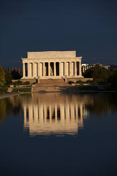 istock Lincoln Memorial and reflecting pool during stormy sunrise 492957424