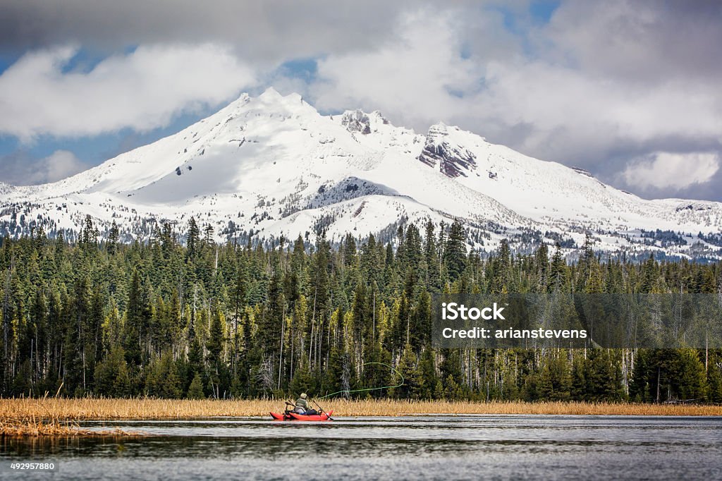 Cascade Lakes Fly Fishing Fly Fishing on the Cascade Lakes Mt Bachelor Stock Photo