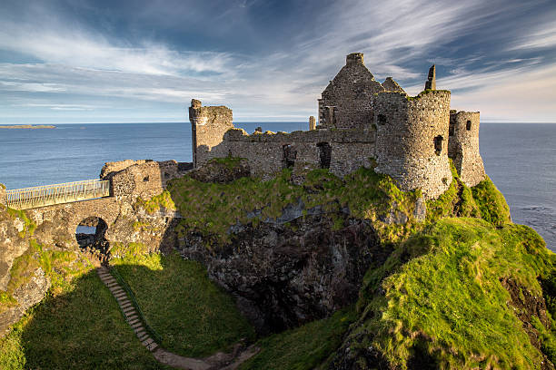 Dunluce Castle Ruins of Dunluce Castle, Northern Ireland, Co. Antrim  atlantic ocean photos stock pictures, royalty-free photos & images