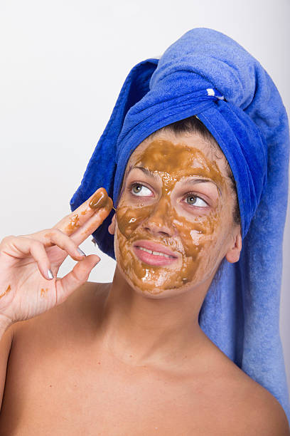 istock woman with facial mask 492960606