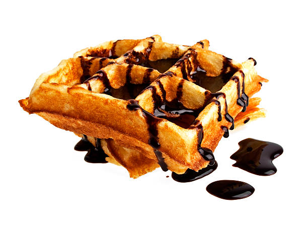 istock Freshly baked belgium waffles with chocolate on white background 492960748