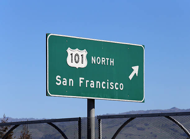San Francisco Castro street sign with a blurred apartment building in the background.