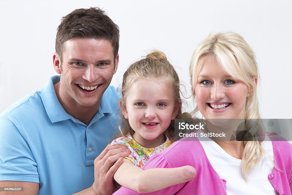 Portrait Of Family With Disabled Daughter At Home 25-29 Years Stock Photo