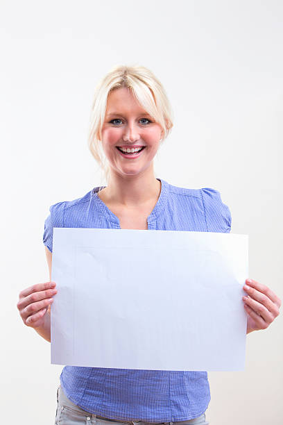 istock Young Woman Holding Blank Sign On White Background 492962351