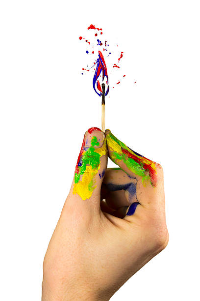 istock Hand holding a burning paint safety match 492962387