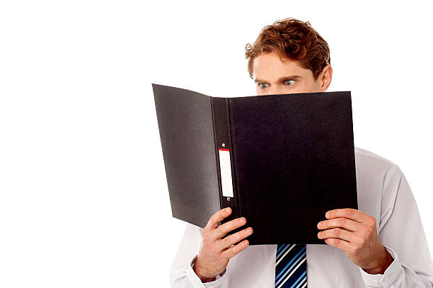 istock Male executive reviewing his company documents 492963309