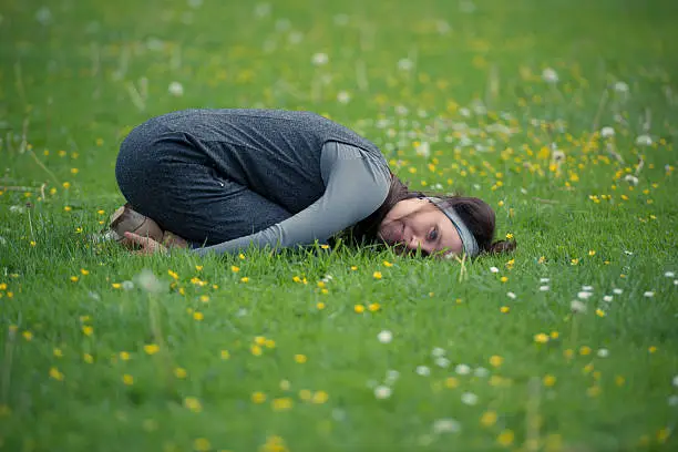 Young woman relax in a summer meadow