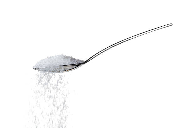 Sugar on teaspoon sugar/salt on teaspoon over white teaspoon stock pictures, royalty-free photos & images