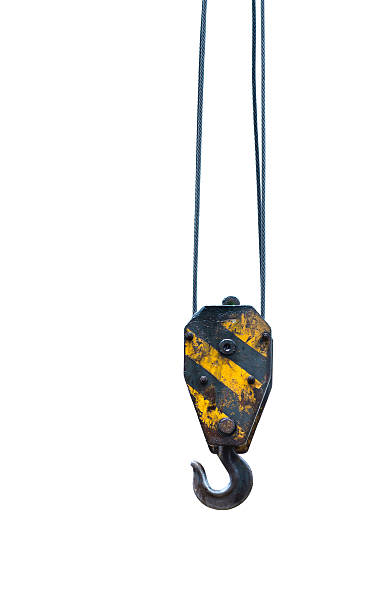 istock Black and yellow cranes hooks hanging on steel ropes 492966072