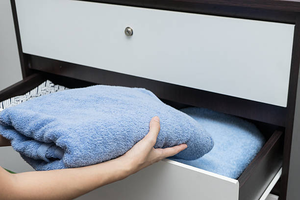 istock Woman hand open drawer and picking up Towel 492966294