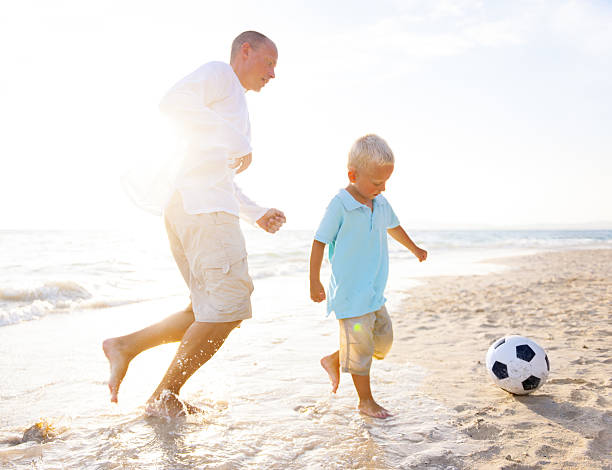 istock Family playing on the beach 492966741