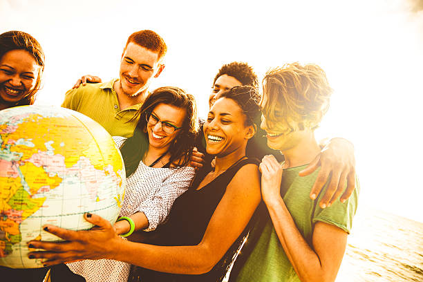 istock Group of friends holding an earth globe 492966879