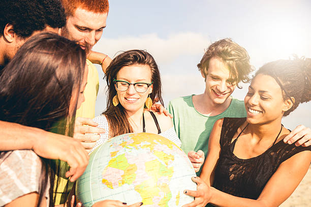 istock Group of friends holding an earth globe 492966899