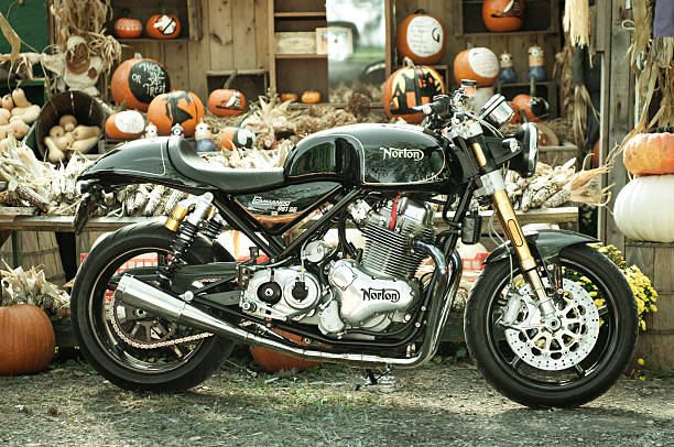 Norton 961 Commando at a Fruit Stand Pelham, Ontario, CANADA - October 12, 2015: A very Rare Norton 961 SE Motorcycle #112 of only 200 bikes in the world posing in front of a fruit stand selling pumpkins. Pelham, Ontario, CANADA norton brand name stock pictures, royalty-free photos & images