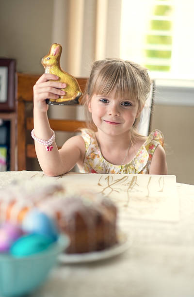 istock Little girl with  a chocolate bunny . 492967989