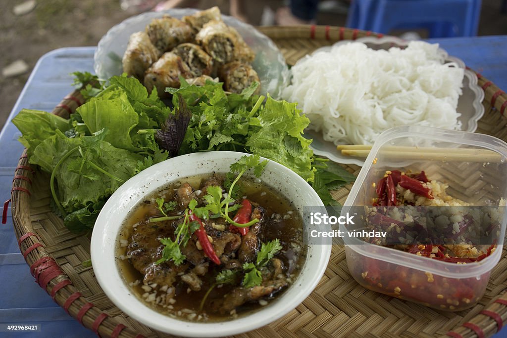 Grilled chopped meat with vermicelli A bamboo tray with grilled chopped meat and vermicelli called Bun Cha in Hanoi Adulation Stock Photo