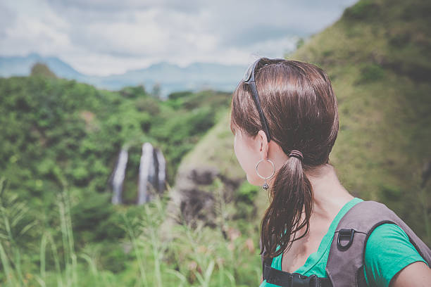 istock Woman Looking at Opaeka'a Falls, kauai, Hawaii 492968902