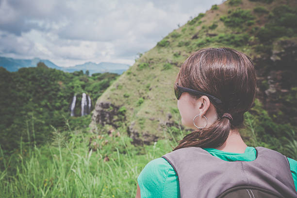istock Woman Looking at Opaeka'a Falls, kauai, Hawaii 492968984