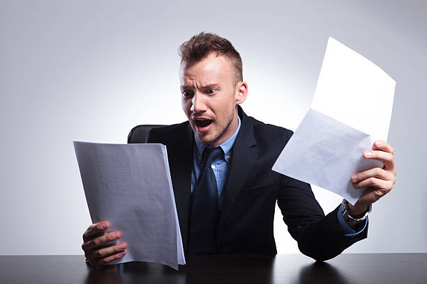 istock business man reads his bills 492969083