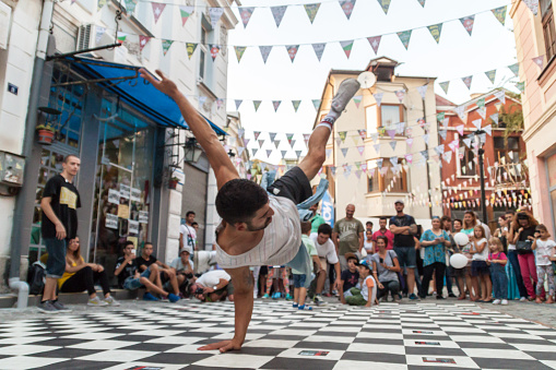 Plovdiv, Bulgaria - September 19, 2015: Kapana street festival in Plovdiv, Bulgaria. Teenagers preform break-dancing in front of the crowd on the street.
