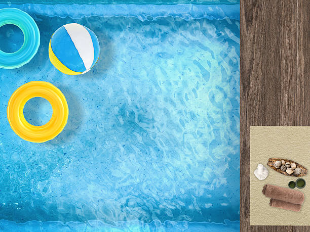 istock pool top view with swim rings and beach ball 492969402