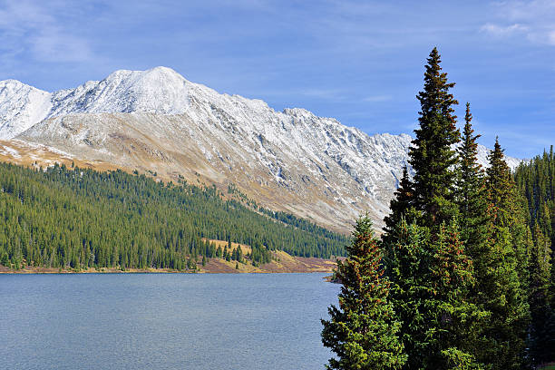 istock snow covered mountains and trees during foliage season 492970692