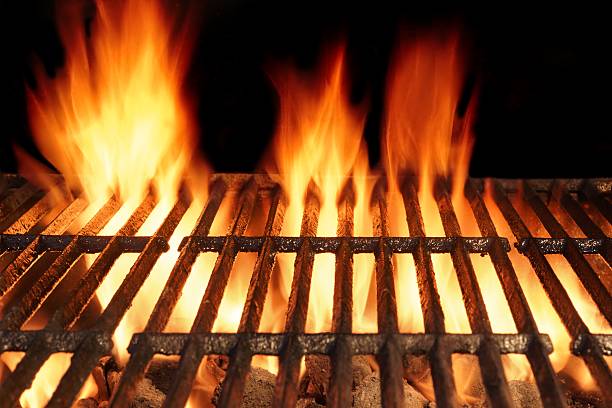 istock Empty BBQ Cast Iron Hot Grill With Burning Charcoal Fire 492970736