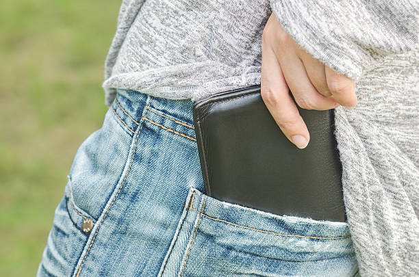 istock Woman pulling out her wallet from the pocket 492971196