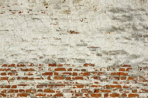 istock Red White Retro Brick Painted Wall With Damaged Plaster 492981540