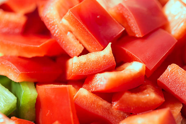 istock Red peppers cut on a salad background texture 492982546