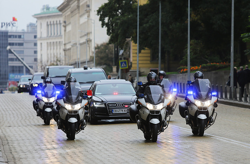 Sofia, Bulgaria - October 15, 2015: Cortege of a Chinese delegation in Sofia. The cars of the diplomats are surrounded by policemen on police motorcycles.