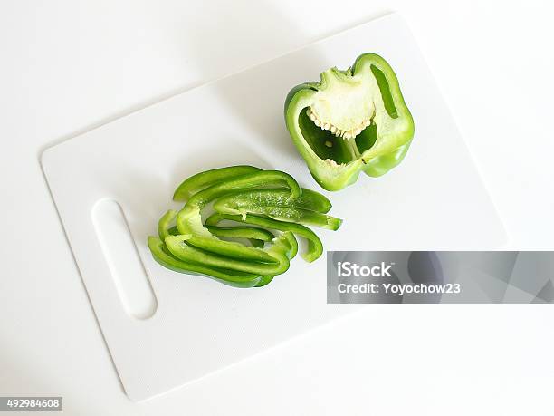 Bell Pepper Stock Photo - Download Image Now - Green Bell Pepper, Cutting Board, Plastic