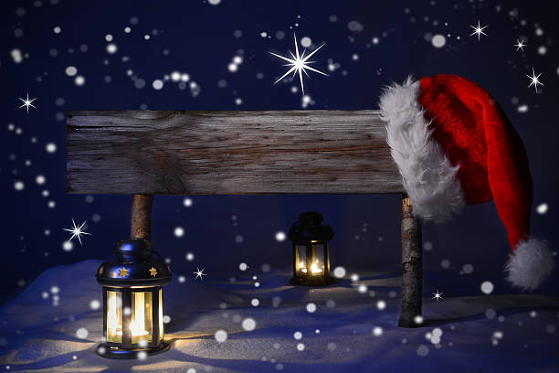 istock Christmas Sign Candlelight Santa Hat Copy Space 492985630