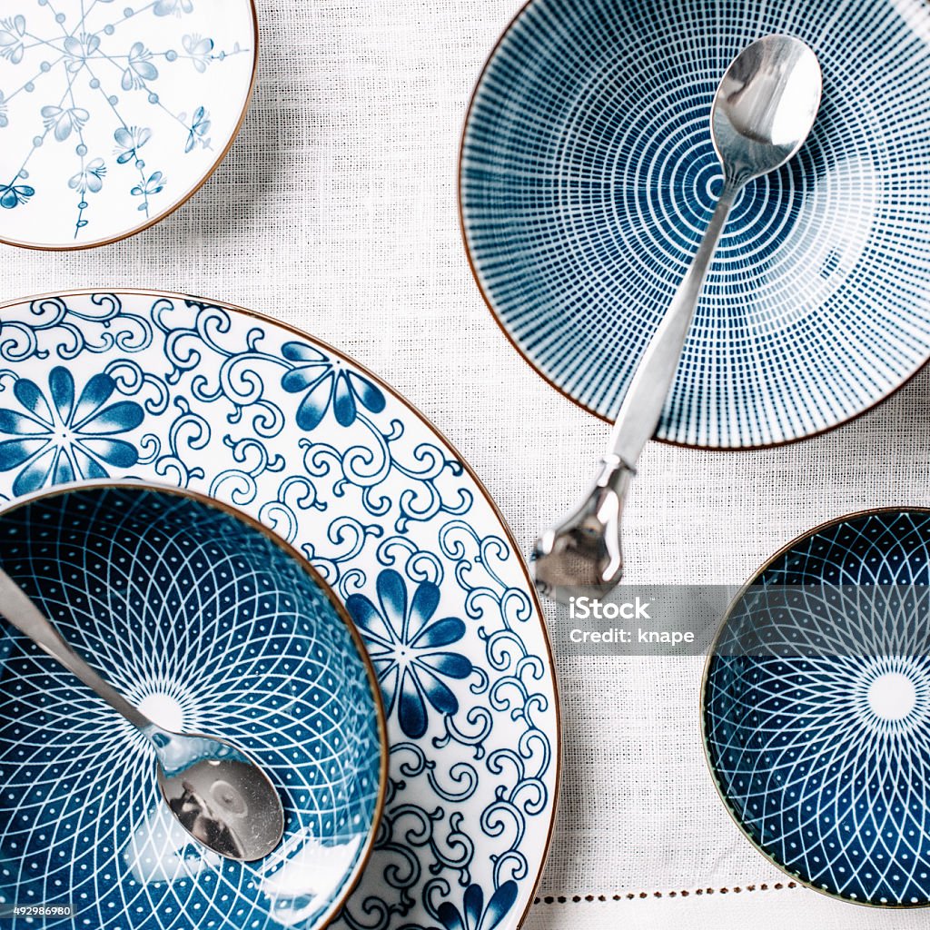 Blue table ware plates and bowls overhead Crockery Stock Photo