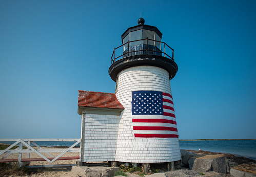 A small lighthouse in Nantucket harbor.