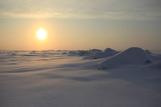 istock Sunrise over a misty sea shore in winter 492988570