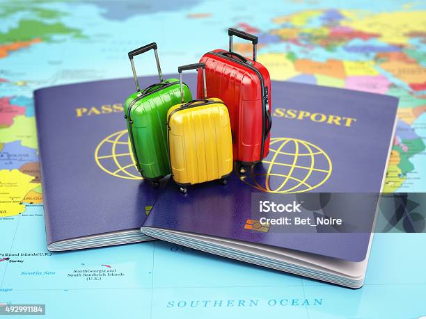 Travel Or Tourism Concept Passport And Suitcases On The Map Stock Photo - Download Image Now