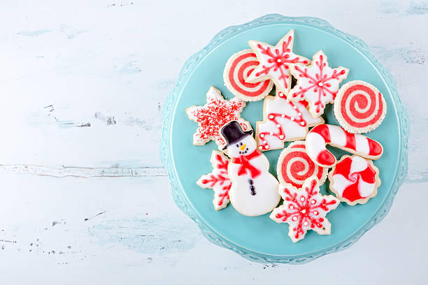 Christmas Sugar Cookies Red and White Christmas Sugar Cookies on a plate white sugar cookie stock pictures, royalty-free photos & images