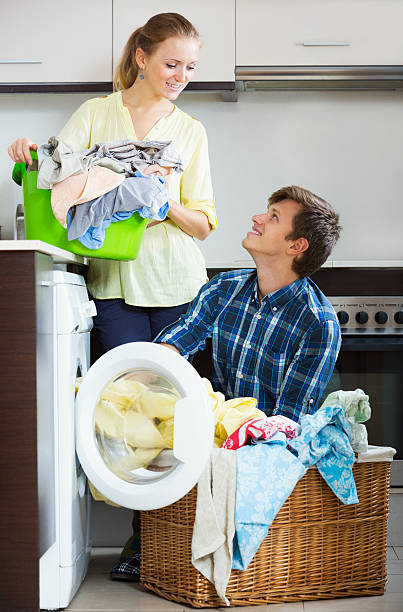 istock couple near washing machine 492992608
