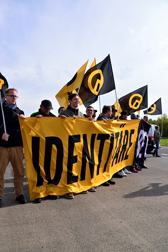 Nickelsdorf, Austria – October 17, 2015: activists of the identitarian movement Austria block the access-road to the border from Hungary to Austria at Nickelsdorf.